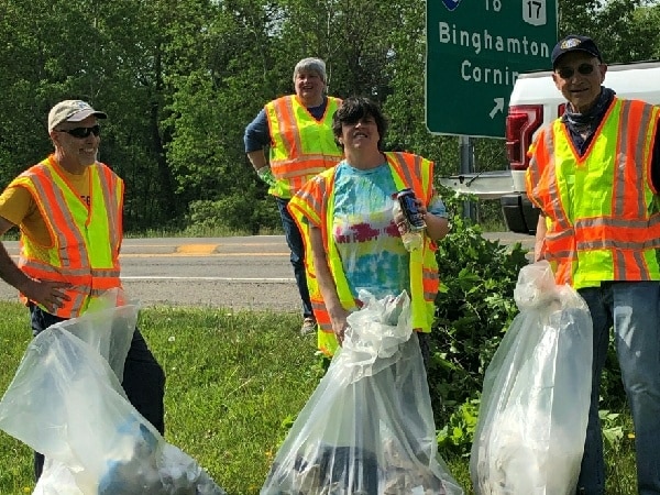 Owego Kiwanis Club picks up trash, pulls weeds, trims plantings on Route 17C circle