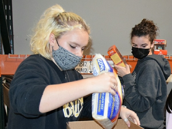 Vestal High School IB students volunteer at CHOW food pantry to help community