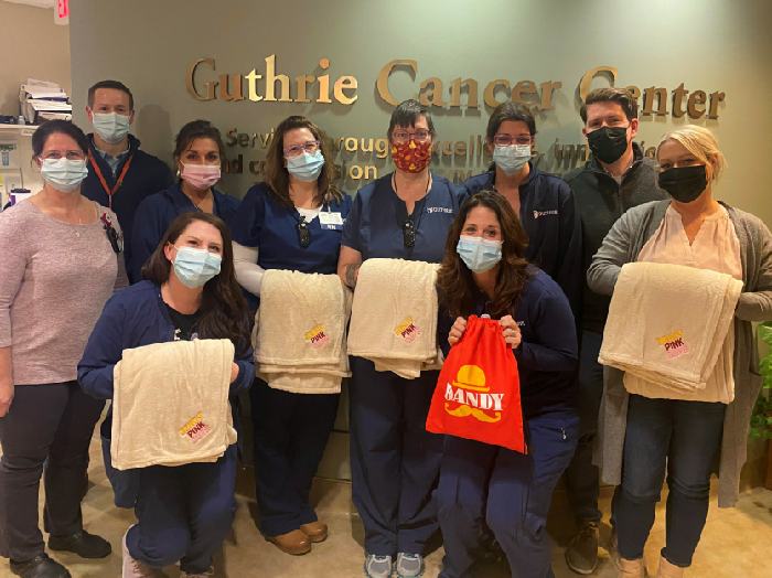 Dandy Mini Marts donate ‘Pink Cups for A Cure’ blankets to Guthrie Cancer Center