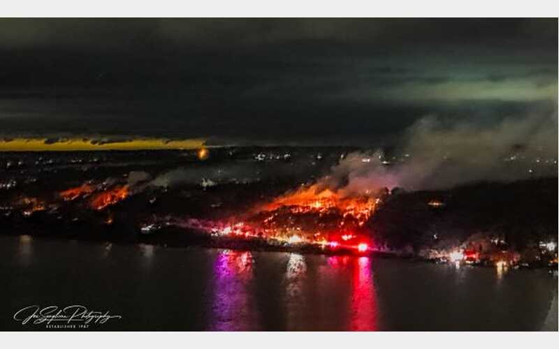 Firefighter injured during large brush fire in Lansing