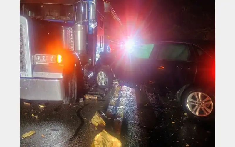 Car, tractor trailer involved in accident on 220