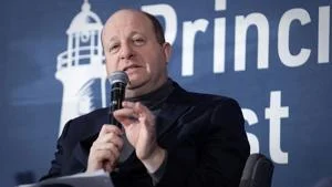 Polis extends spending cuts as Colorado faces $800M gap